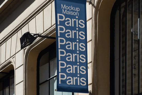 Blue vertical banner mockup on building facade with bold white text reading Paris repeated, clear urban setting, perfect for designers font display.