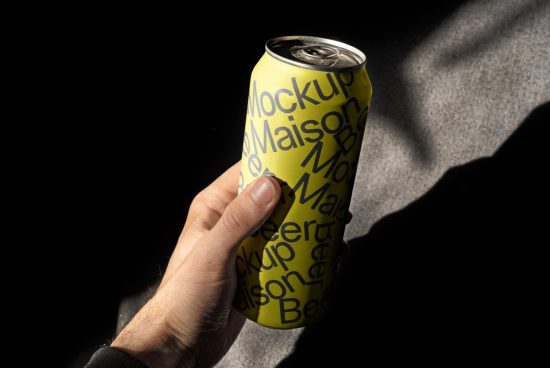 Hand holding a can mockup with typographic design in natural lighting, suitable for branding presentations and product mockups.