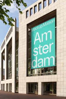 Turquoise banner on modern stone building window displaying Amsterdam text
