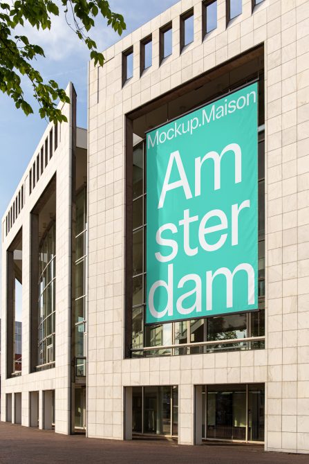 Urban building facade mockup displaying a large banner with the text "Amsterdam" for graphic design presentations.