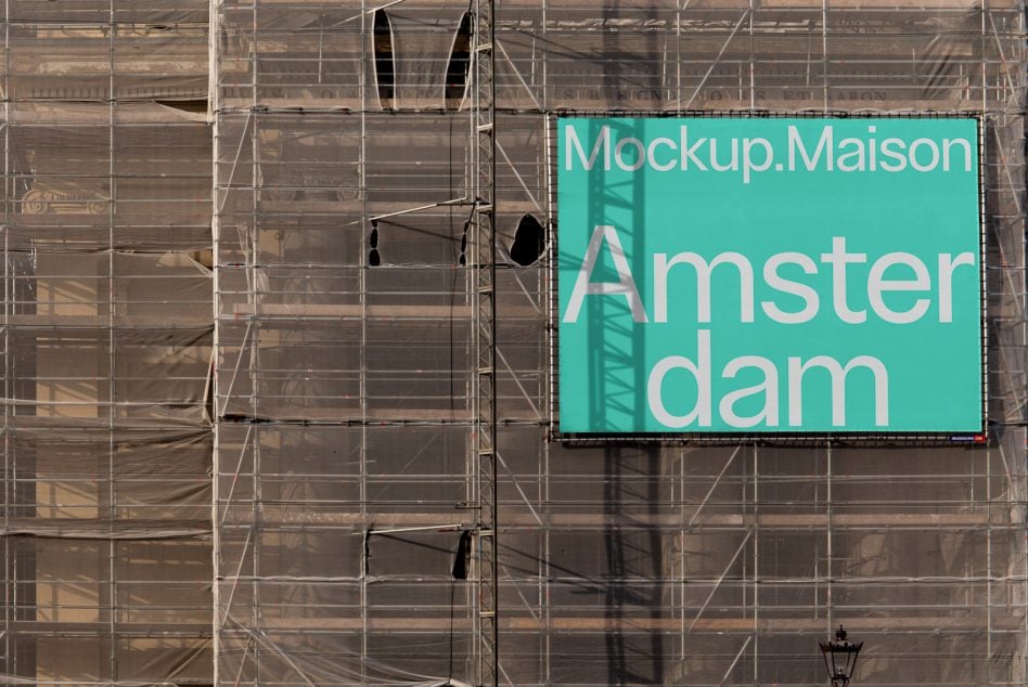 Turquoise billboard on scaffolded building facade displaying Mockup.Maison Amsterdam