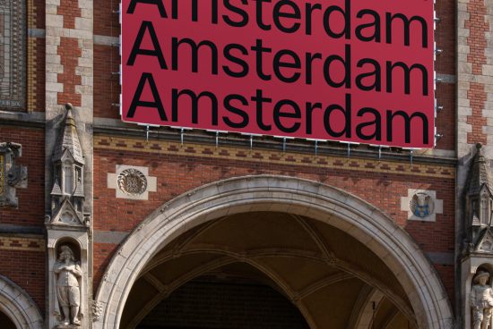 Bold red font showcasing "Amsterdam" on banner hung on historic building facade, ideal for font showcase or graphic design mockups.