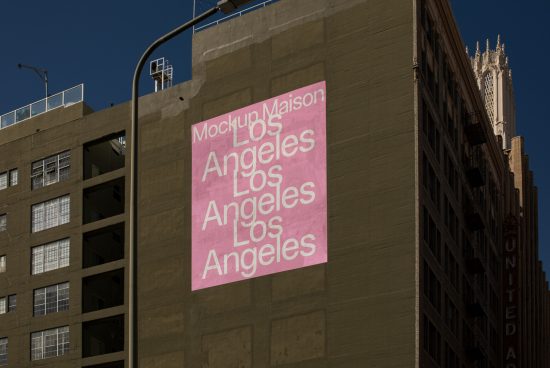 Urban billboard mockup on building with repeating Los Angeles text, ideal for presenting outdoor advertising designs to clients.