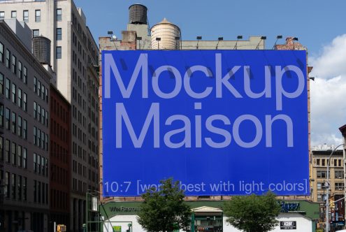 Urban billboard mockup on a building facade with blue background and bold white font, ideal for presenting designs and advertising to clients.