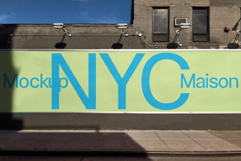 Wall billboard mockup with NYC Maison text for urban advertising design in a realistic outdoor setting, perfect for designers.