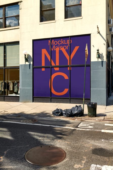 Urban storefront mockup with bold typography on a building facade for design showcase, realistic city environment for presentation.