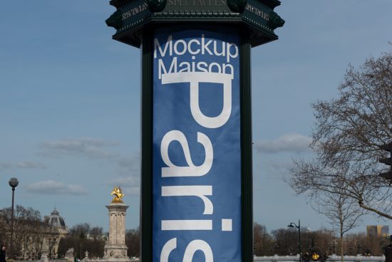 Outdoor banner mockup hanging on a Parisian Morris column with city background for advertising and poster design presentations.