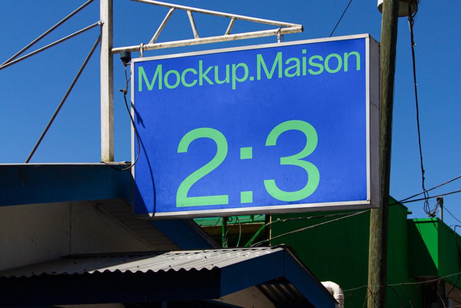 Street sign mounted on beam, blue background with lime text displaying 2:3 ratio