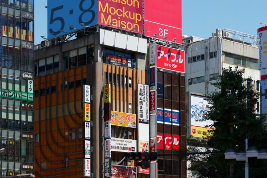 Urban billboard mockup on a building facade with various Japanese signs and clear blue sky, perfect for showcasing advertising designs.