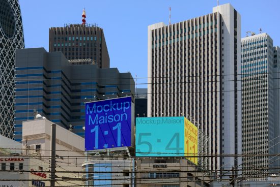 Billboard mockup templates on urban buildings with clear blue sky background, suitable for outdoor advertising designs and cityscape graphics.