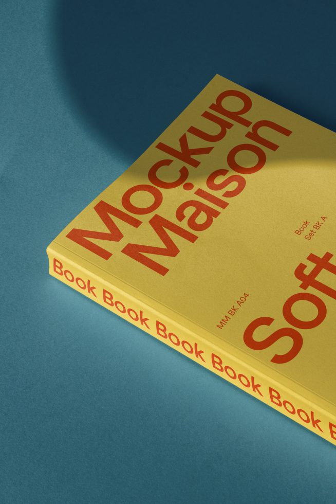 Yellow book mockup tilted on a blue background showcasing spine and cover design, ideal for presentations and portfolio, realistic shadows.