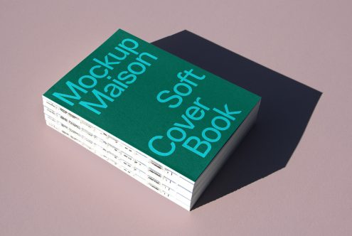 Green softcover book mockup with shadow on a pink background, ideal for designers to present book cover designs and portfolios.