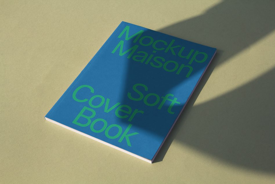 Blue gradient softcover book on cream background with green text