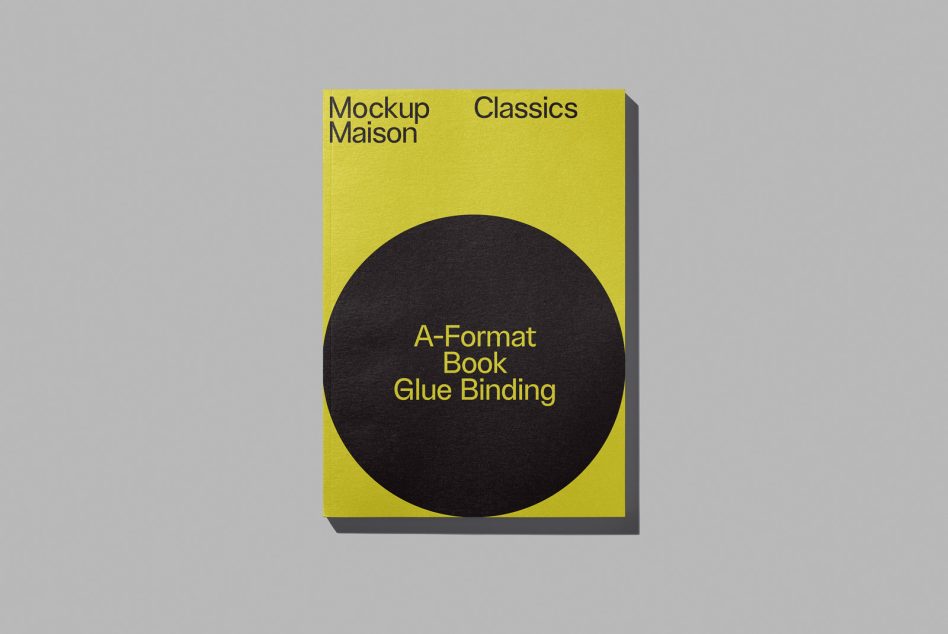 Yellow and black book cover mockup with glue binding on grey background, ideal for presenting graphic designs and font showcase.