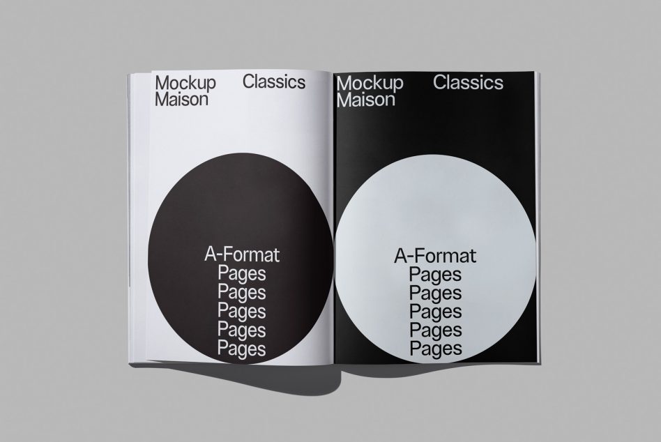 Open magazine showing contrasting pages, white with dark circle, black with light circle