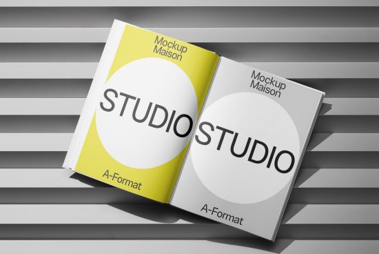 Open magazine mockup on striped background displaying design studio portfolio, ideal for digital mockup assets and graphic designers.