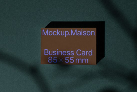 Professional business card mockup on a textured dark background, showcasing design space, ideal for designers, presentations, and branding.