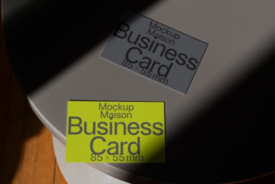 Business card mockups on a laptop screen in sunlight, showcasing design versatility for graphic assets, ideal for designers portfolio.