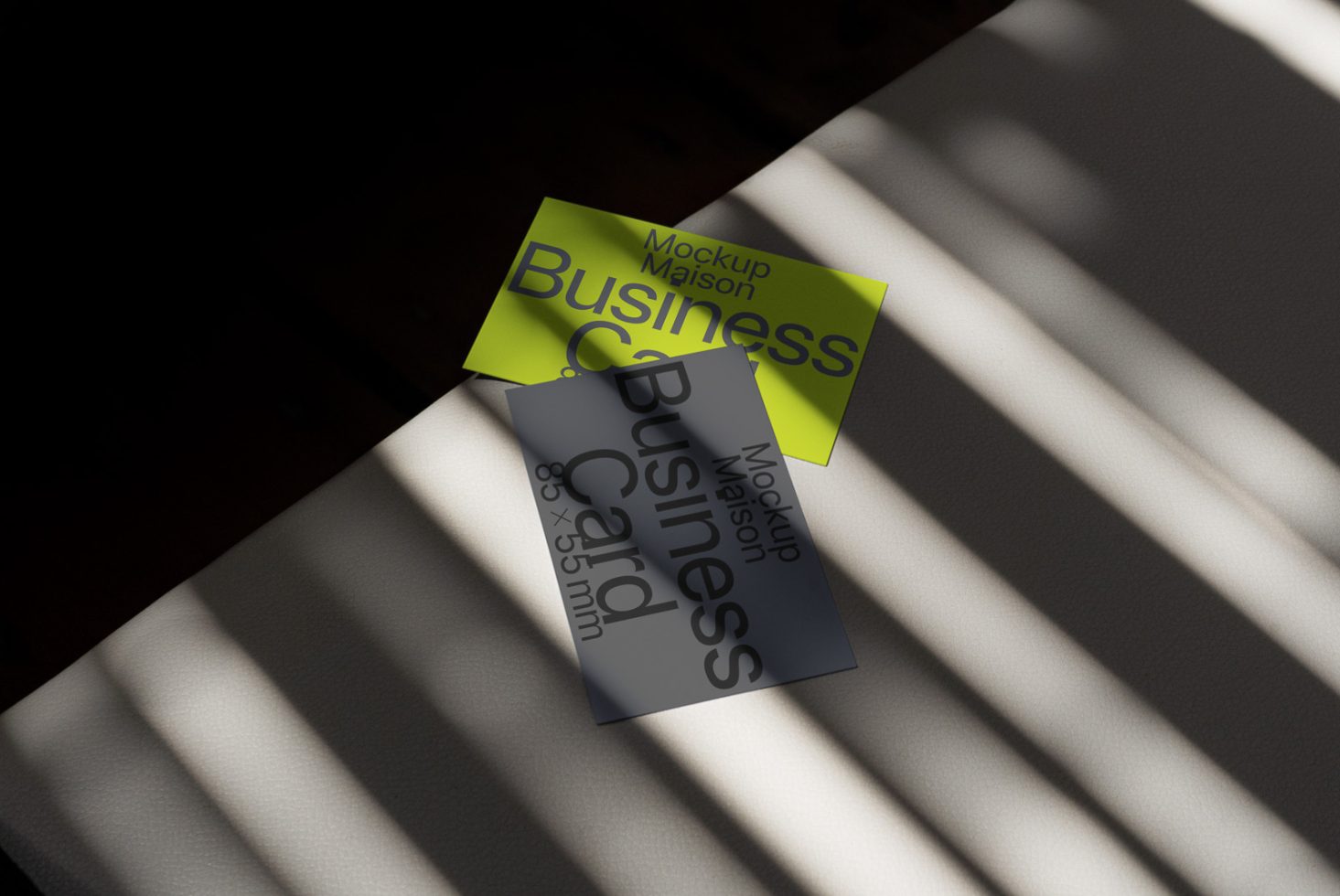 Business card mockup with natural lighting and shadows, showcasing design for creatives and print templates.