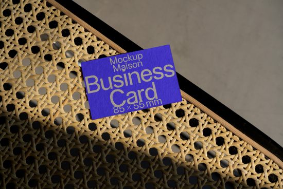 Business card mockup on geometric patterned background, highlighting design presentation, suitable for graphics and templates.