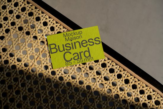 Business card mockup on textured backdrop, highlighting design space for branding, ideal for designers seeking professional presentation tools.