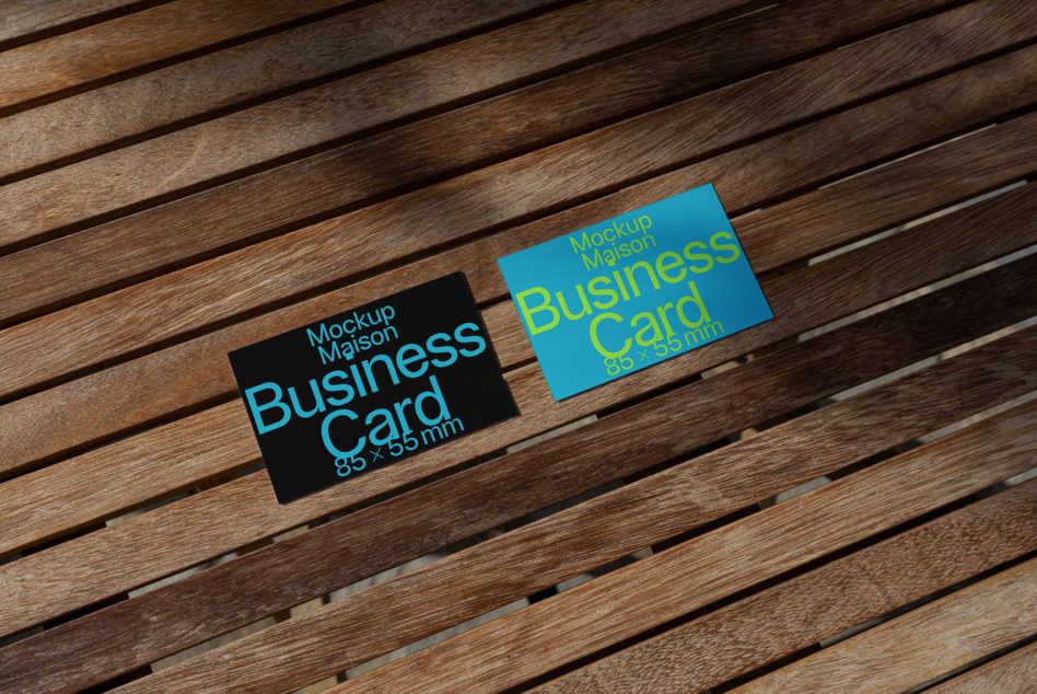 Business card mockups lying on wooden slats. Professional design asset for presenting corporate identity. Ideal for graphic designers' portfolios.