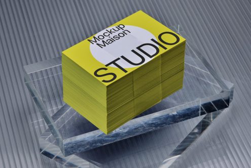 3D logo mockup on textured paper stack with transparent crystal base for graphic designers display.