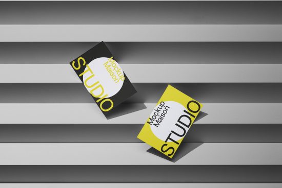 Business card mockup with a dynamic shadow on striped background, showcasing design space for branding, ideal for designers and creatives.