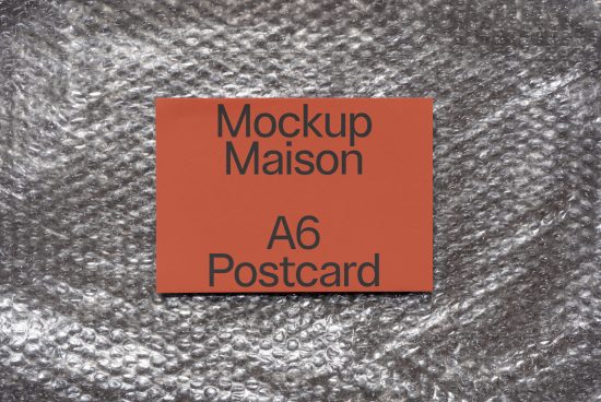 A6 Postcard mockup on textured silver bubble wrap background, showcasing modern design for graphic presentation and portfolio display.