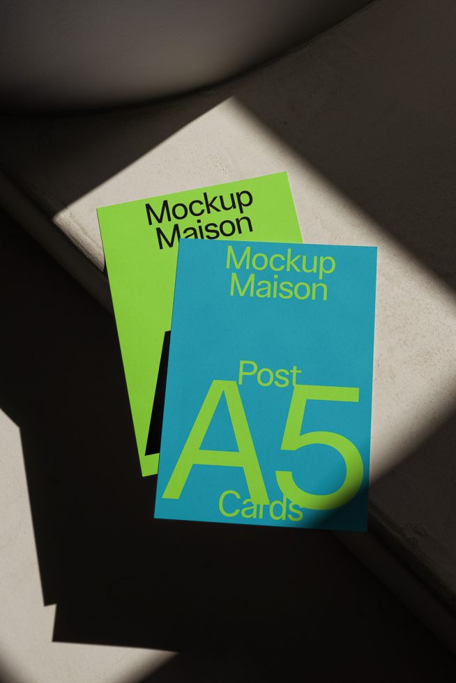 A5 card mockups in green and blue with elegant shadows, perfect for presentations and showcases in graphics and templates categories.