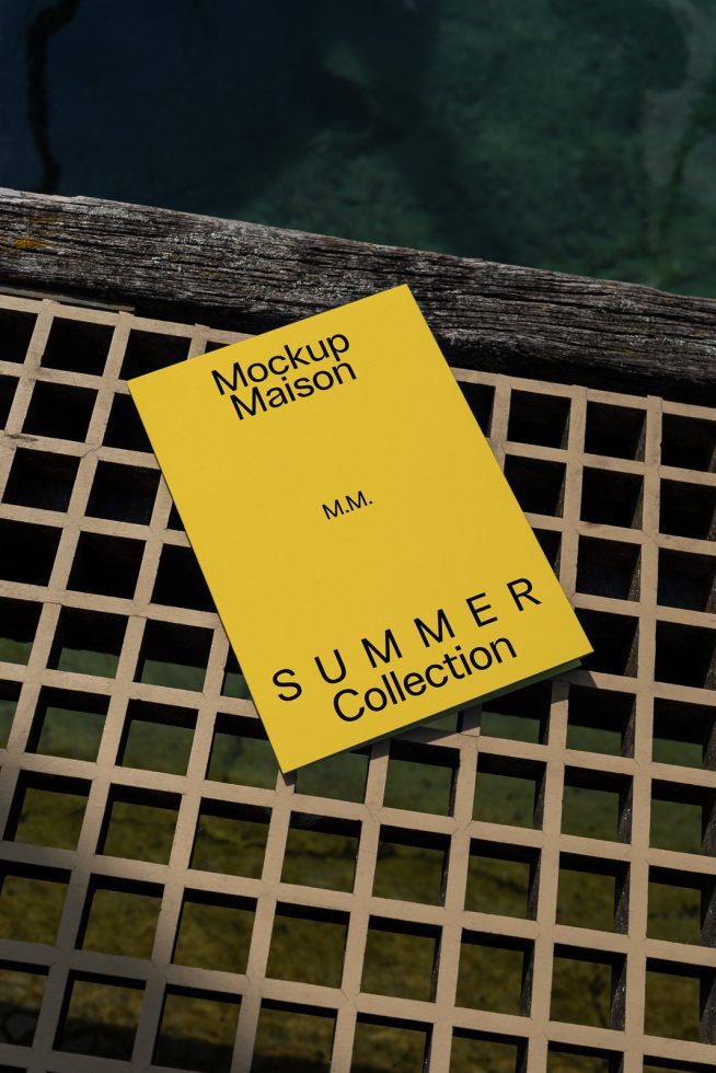 Yellow brochure mockup on rustic wooden lattice by water for summer collection presentation, ideal for designers showcasing print design templates.