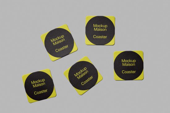 Product mockup of square coasters with rounded corners, featuring yellow borders and a central black area with the text "Mockup Maison Coaster".
