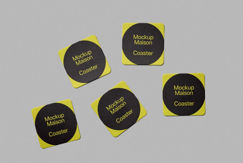 Product mockup of square coasters with rounded corners, featuring yellow borders and a central black area with the text "Mockup Maison Coaster".