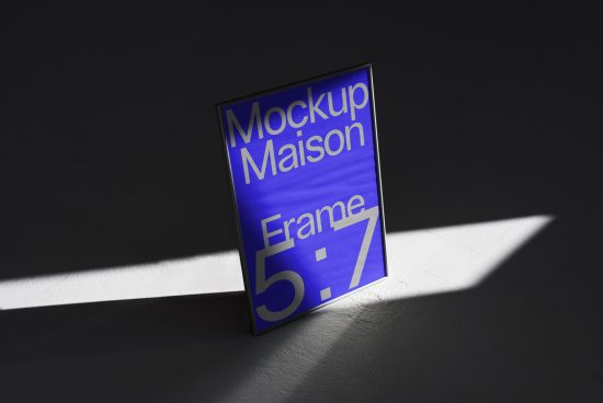 Realistic frame mockup in shadow with blue graphic design, 5:7 ratio, ideal for presentations and portfolio display.