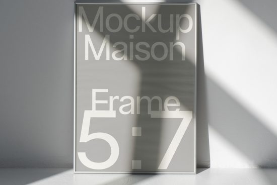 Modern poster frame mockup in sunlight for showcasing design work, sleek style for graphic designers and poster presentations.