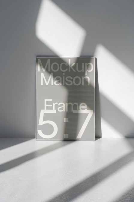 Elegant frame mockup in sunlight for showcasing art and design work, perfect for templates category with realistic shadows and modern style.