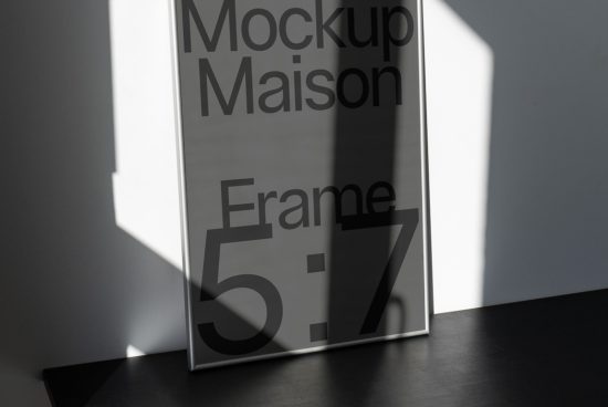 Modern frame mockup with shadow overlay for presentation, standing on dark floor, ideal for designers, Mockups category.
