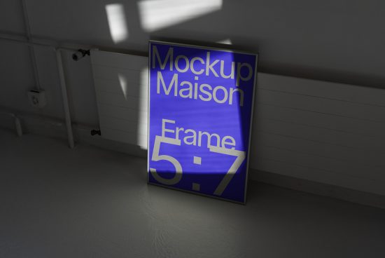 Realistic poster frame mockup in shadowed interior for product display, designers' presentations, 5x7 ratio, minimalistic style.