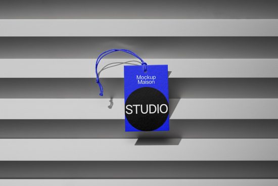Blue hang tag mockup with shadow on striped background, showcasing branding design, suitable for designers' mockups collection.