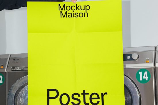 Bright yellow poster mockup held in front of washing machines, showcasing bold typography design, ideal for graphic presentations by designers.