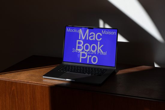 Laptop mockup on wooden desk with dynamic shadows, displaying screen resolution for design presentations, ideal for Mockups category.