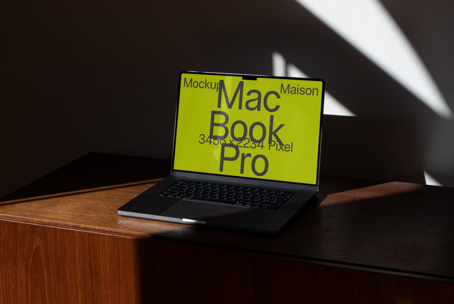 Laptop mockup on wooden desk with play of light and shadows, ideal for presenting digital designs and templates.