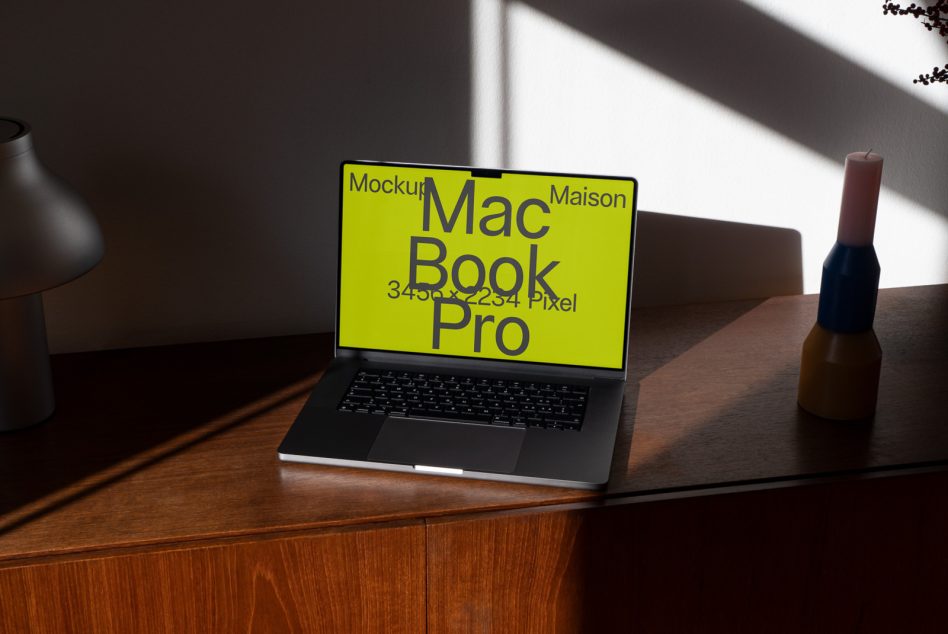 MacBook Pro mockup with neon yellow screen on styled desk