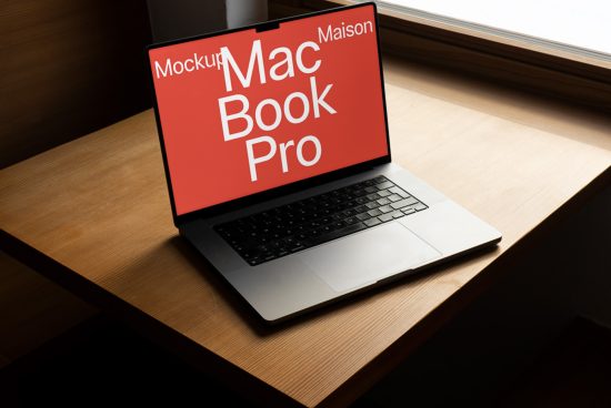 Laptop mockup on a wooden desk by the window, showcasing MacBook Pro screen with customizable design for digital asset marketplace.