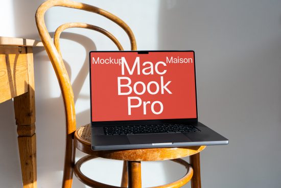 Laptop on wooden stool with screen showing MacBook Pro mockup, ideal for designers looking for mockups, digital assets, and presentation templates.