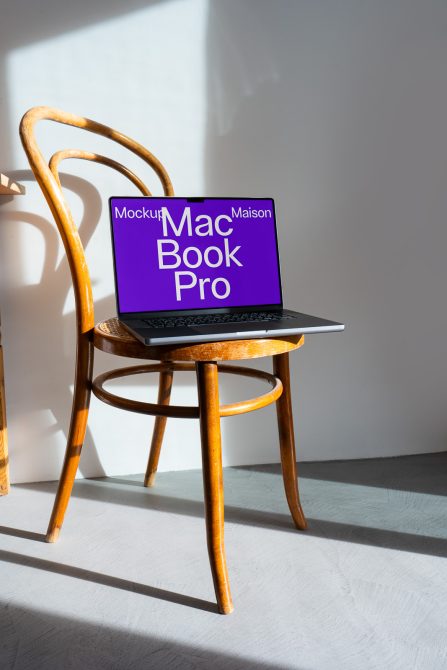 Laptop mockup on wooden chair in sunlight for digital asset design, ideal for presentations, tech-related graphics, and creative templates.