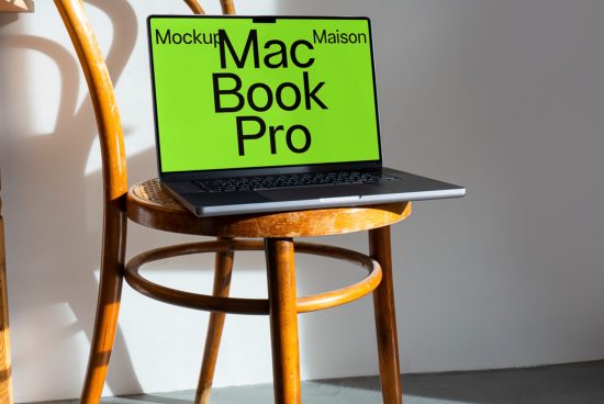 Laptop mockup on wooden chair in sunlight for design presentation, ideal for showcasing web and app designs, realistic digital asset.