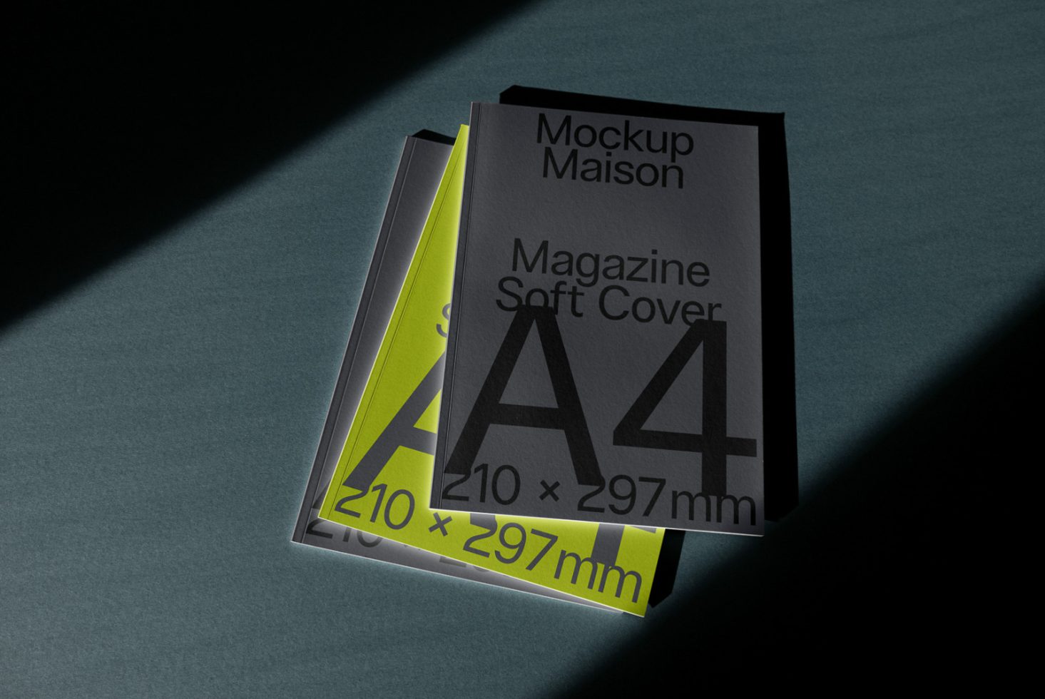 A4 magazine soft cover mockup on dark background, angled view with dramatic shadow, suitable for graphic design presentations.