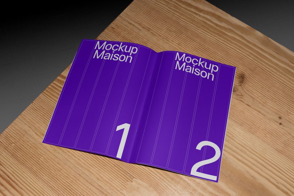 Bright purple open hardcover book mockup with vertical ribbed detail on wood surface