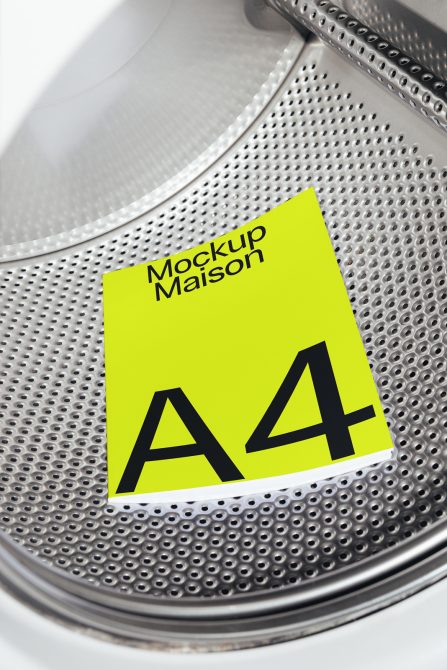 Alt: Neon yellow A4 paper mockup with black text set inside a washing machine drum, perfect for showcasing design versatility in mockups category.